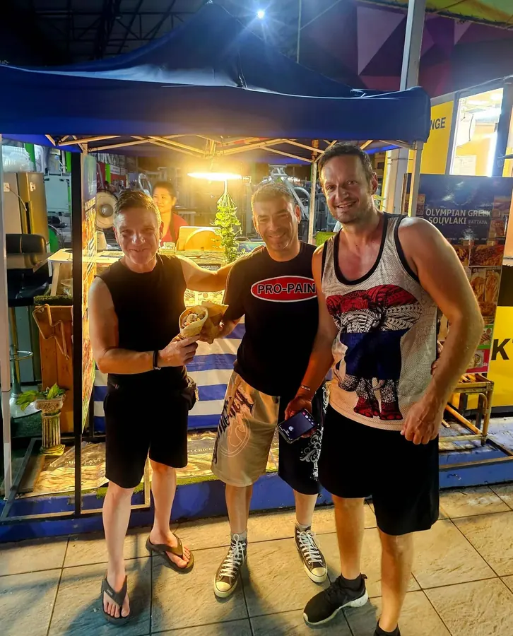 Customers enjoying dinner at the booth at night