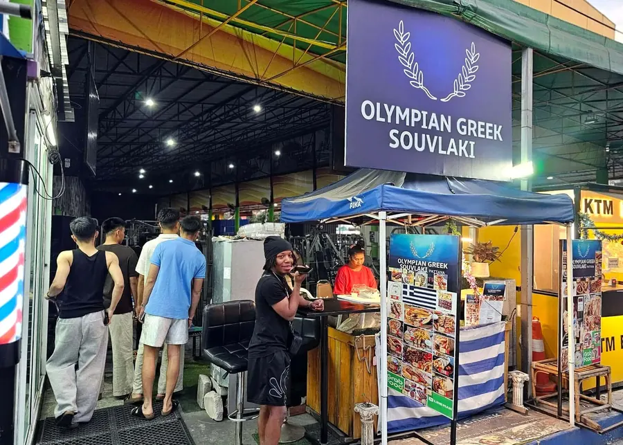 A queue forms at the Olympian Greek Souvlaki booth